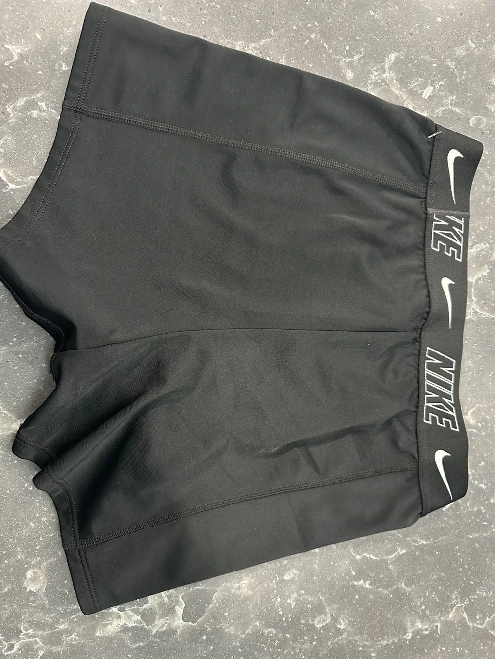 Nike Black Athletic Compression Shorts with White Swoosh and Branded Waistband